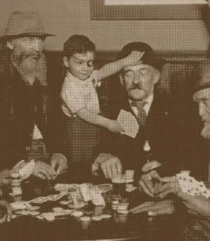 Young Reilly gambling with a group of men